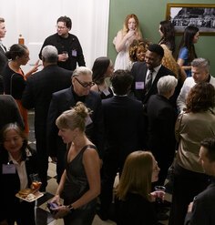 A crowd of people interacting at the 2025 LAF Annual Benefit