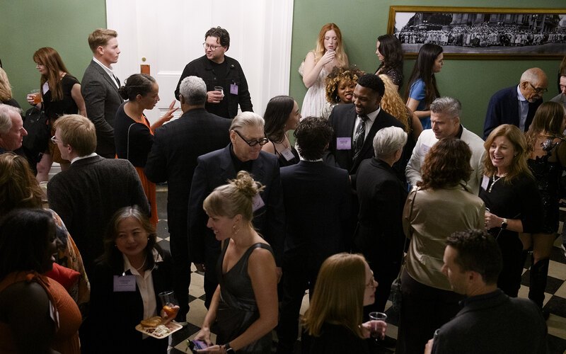 A crowd of people interacting at the 2025 LAF Annual Benefit