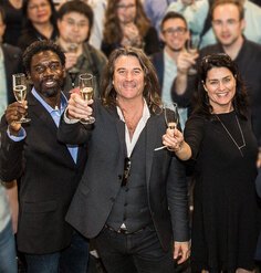 Richard Weller among the crowd leading a champagne toast