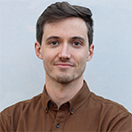 Adrian Robins smiles