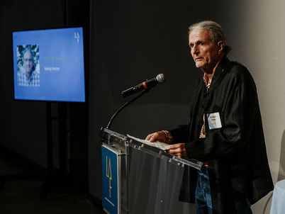 Randy Hester at a podium giving remarks after receiving the 2023 LAF Medal 